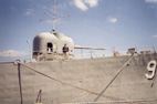 View of Turret 1 from the pier.  Note the pronounced sheer at the bow characteristic of Hull class destroyers.