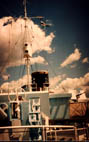 Looking aft from forecastle deck; view of mast and port bridge wing